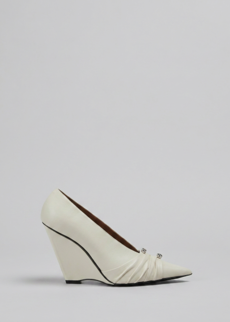 White Wedge Pump on Light Grey Background